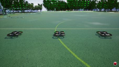 Three simulated quadrotor UAVs aligned in formation on a sports field